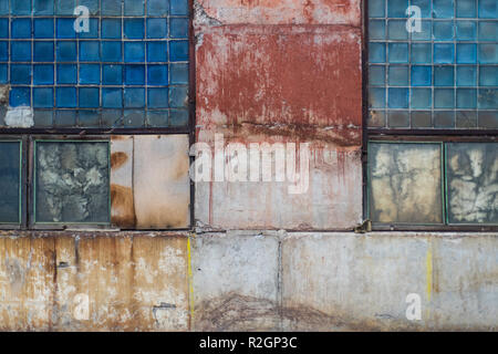 Old grungy block glass and painted concrete warehouse texture from USSR, can be used in graphic design Stock Photo