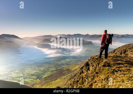 Hill Walker Enjoying the View South over St John’s in the Vale from Blencathra, Lake District, Cumbria, UK. Stock Photo