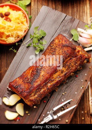 Rosted ribs with spices on wooden board Stock Photo