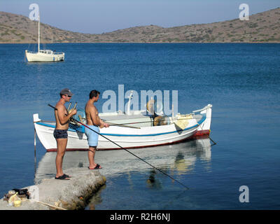 Two fishing rods and reels on board a game fishing boat in the