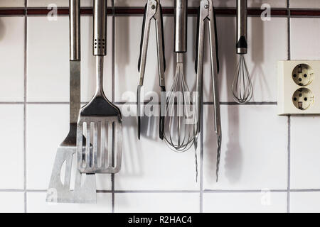The kitchenware hanging on the wall in the kitchen Stock Photo