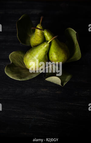 Pears arranged on leaves Stock Photo