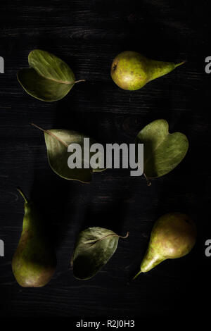 Pears arranged on leaves Stock Photo