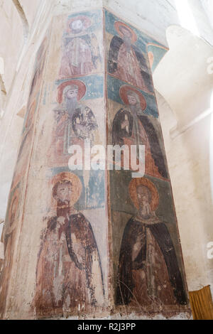 ANANURI, GEORGIA - SEPTEMBER 24, 2018: On column of Assumption Church depicted Thirteen Assyrian Fathers, saints of Orthodox Church, founders of Georg Stock Photo