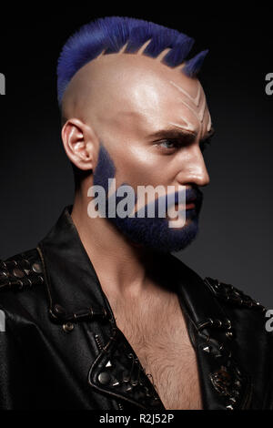 Young man with blue hair and creative makeup and hair Stock Photo - Alamy