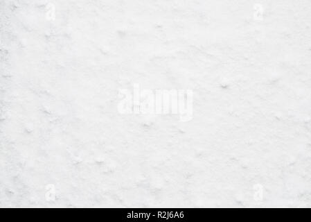 White powdery snow background. Snow for winter concept design. Natural snow texture. Abstract snow background. Stock Photo