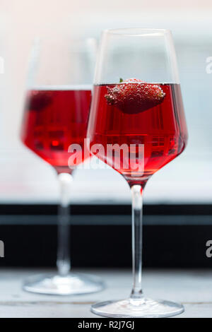 Romantic composition. Strawberry in pink champagne in glasses Stock Photo