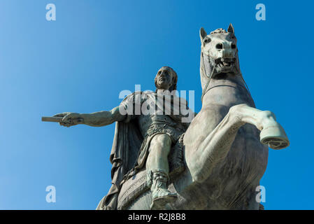 Monuments at the Church of San Francesco di Paola against the blue sky. Monument to Ferdinand the first. Stock Photo