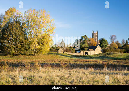 St James' church in morning sunlight with autumn trees, Chipping Campden, Cotswolds, Gloucestershire, England, United Kingdom, Europe Stock Photo
