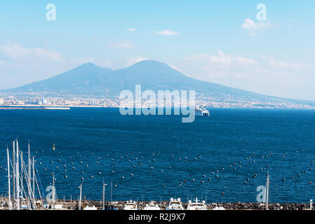 Huge cruise ship on the sea near Naples, Italy. A magnificent landscape with a large ship and a mountain horizon. Stock Photo