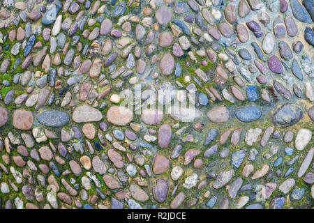 patterned background texture from pebbles pavement Stock Photo