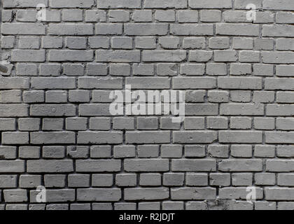 Grunge industrial grey painted brick wall background in Kyiv, Ukraine. May be used in design and interiors. Stock Photo