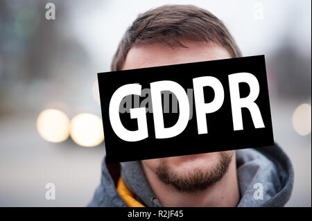 gdpr, portrait of man on background of highway, faces coverd by general data protection regulation. Stock Photo