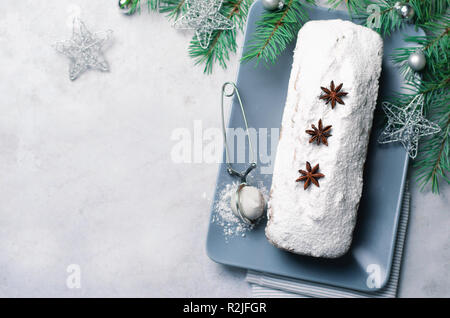 Loaf Cake Dusted with Icing Sugar, Christmas and Winter Holidays Treat, Homemade Pound Cake on Grey Background Stock Photo