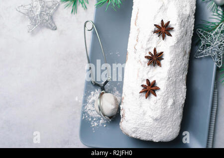 Loaf Cake Dusted with Icing Sugar, Christmas and Winter Holidays Treat, Homemade Pound Cake on Grey Background Stock Photo