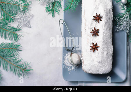 Loaf Cake Dusted with Icing Sugar, Christmas and Winter Holidays Treat, Homemade Pound Cake on Grey Background Stock Photo