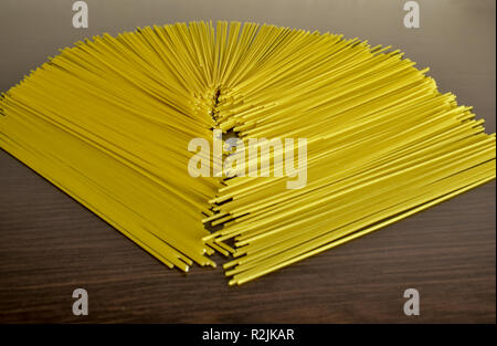 Mixed dried pasta selection on wooden background tasty product Stock Photo