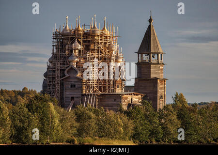 The outdoor museum of Kizhi Island on Lake Onega, Russia. Renovation work taking place on the 1714 22-domed Transfiguration Church. Stock Photo