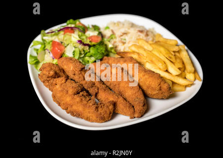 Chicken Goujons served with rice, salad and french friends on plate Stock Photo
