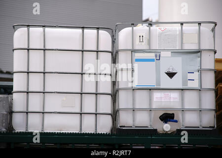 Large acid-proof plastic containers for transportation of corrosive and acidic chemicals, Stock Photo