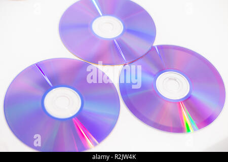 Three DVDs recordable DVDs CD CDs DVDR on a white background Stock Photo