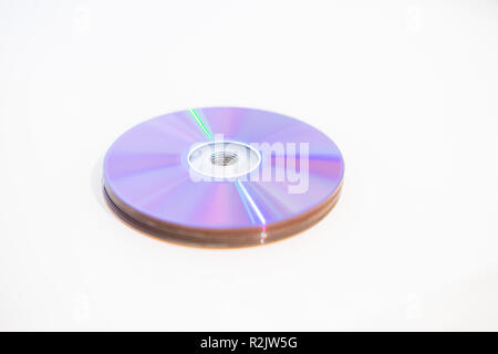 Pile of DVDs recordable DVDs CD CDs DVDR on a white background Stock Photo