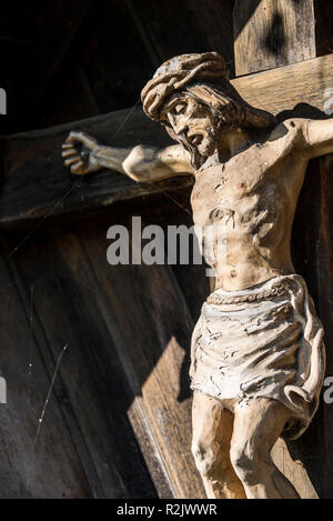 weathered Jesus figure hanging on a wayside cross, Upper Bavaria, Bavaria, Germany, Europe Stock Photo