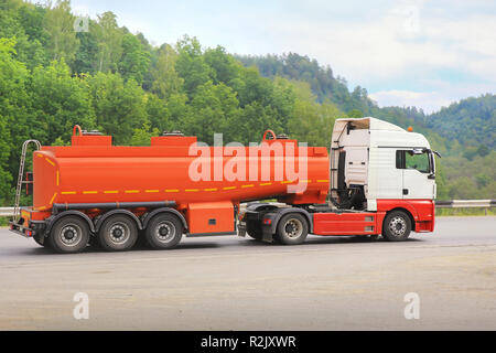 big gas-tank truck goes on highway Stock Photo