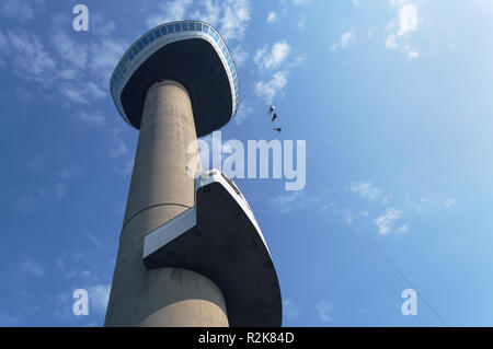 Rotterdam, The Netherlands, October 6, 2018: View from below on Euromast with blue sky on background and  bungy jumping people Stock Photo