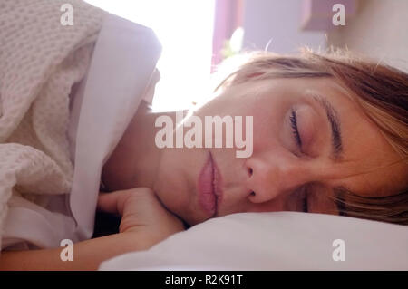 A middle-aged woman asleep. Stock Photo