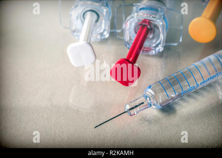 Some syringes of different size, conceptual image medicine Stock Photo