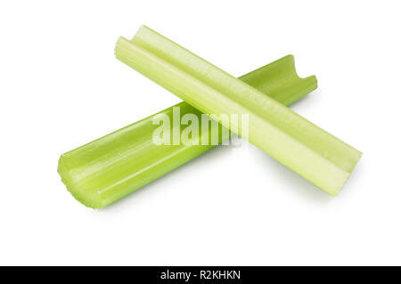 Studio shot of celery stems isolated on a white background - John Gollop Stock Photo