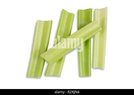 Studio shot of celery stems isolated on a white background - John Gollop Stock Photo