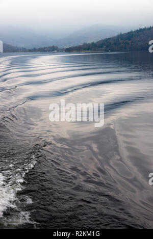 Small Waves and Ripples Caused by Boat Wake with Reflections on Lake Windermere Lake District National Park Cumbria England United Kingdom UK Stock Photo