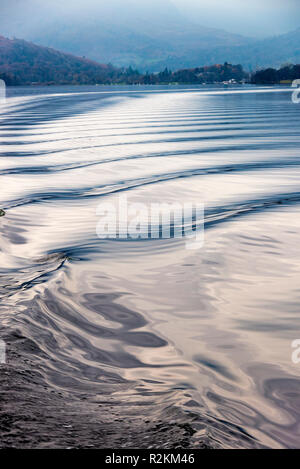 Small Waves and Ripples Caused by Boat Wake with Reflections on Lake Windermere Lake District National Park Cumbria England United Kingdom UK Stock Photo