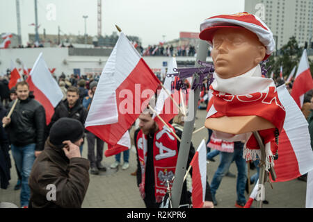 Warsaw, Poland - November 11, 2018: National flags, scarfs, hats, pins could be purchased during Independence March. Stock Photo