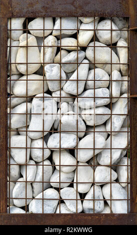 Garbione with white stones and rusted grid Stock Photo