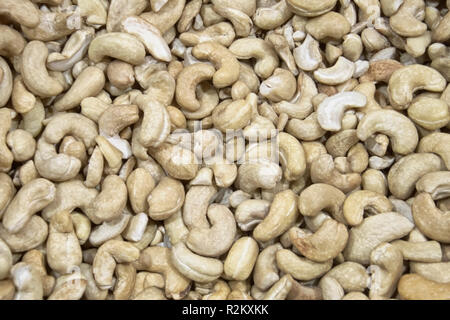 A lot of cashew texture of food lie on a counter in the market Stock Photo