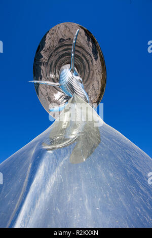 Close-up of a massive chromed sculpture of whales Stock Photo