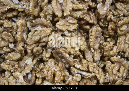 A lot of walnut without shell texture of food lie on a counter in the market Stock Photo