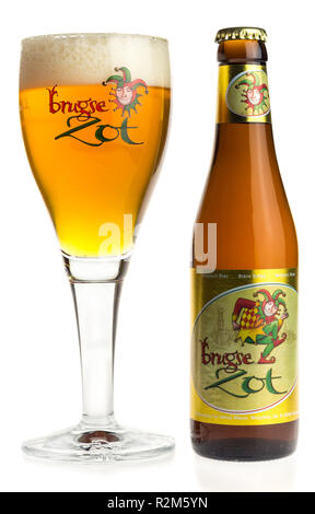 Bottle and glass of Brugse Zot beer isolated on a white background Stock Photo