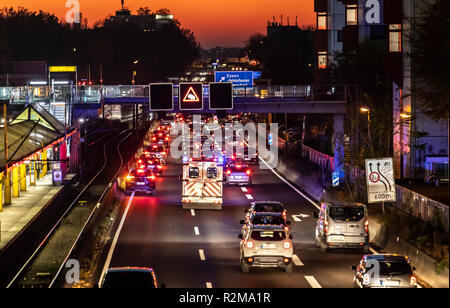 Ambulance drives with blue lights and sirens, on a highway, A40 in Essen, to an emergency mission, rescue lane, Germany Stock Photo