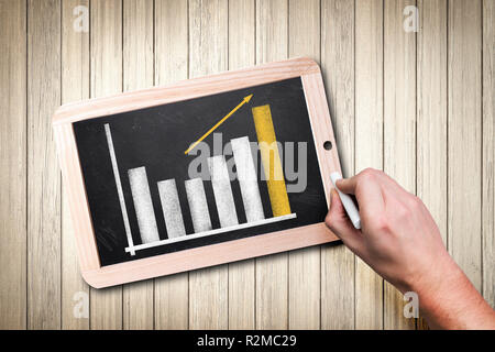 hand is drawing a diagram on a chalkboard Stock Photo