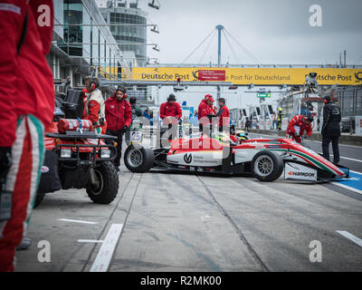 Formula 3 racing car in the pit lane, Prema Powerteam Stock Photo