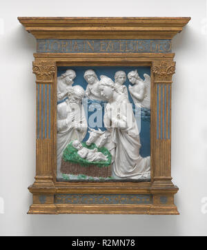 The Nativity. Dated: c. 1460. Dimensions: overall: 56.5 x 47.9 cm (22 1/4 x 18 7/8 in.)  framed: 106.7 x 68.6 x 12.1 cm (42 x 27 x 4 3/4 in.)  framed weight: 31.752 kg (70 lb.). Medium: glazed terracotta. Museum: National Gallery of Art, Washington DC. Author: Luca Della Robbia. Stock Photo