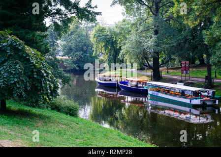 Riga canal, pleasure boats in Bastion Hill Park, Bastejkalns, in the City Canal area of central Riga. Riga, Latvia, Baltic states, Europe. Stock Photo