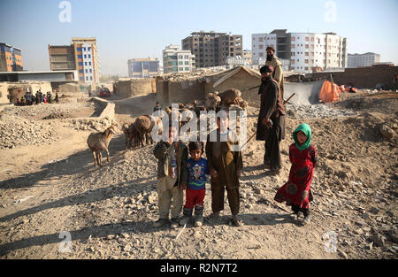 (181120) -- KABUL, Nov. 20, 2018 (Xinhua) -- Afghan children stand outside their mud houses on World Children's Day in Kabul, capital of Afghanistan, Nov. 20, 2018. The United Nations Children's Fund (UNICEF) office in Afghanistan said on Monday that about 3.7 million Afghan children have no access to school due to insecurity and poverty in the country. (Xinhua/Rahmat Alizadah) Stock Photo