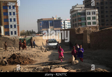 (181120) -- KABUL, Nov. 20, 2018 (Xinhua) -- Afghan children play outside their mud houses on World Children's Day in Kabul, capital of Afghanistan, Nov. 20, 2018. The United Nations Children's Fund (UNICEF) office in Afghanistan said on Monday that about 3.7 million Afghan children have no access to school due to insecurity and poverty in the country. (Xinhua/Rahmat Alizadah) Stock Photo