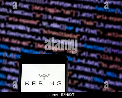 Kering Luxury goods company logo seen displayed on a smart phone. Kering  S.A. is an international luxury group based in Paris, France. It owns  luxury goods brands, including Gucci, Yves Saint Laurent,