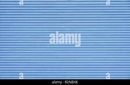 Background texture of pastel blue color painted horizontal metal window roller shutter blinds Stock Photo